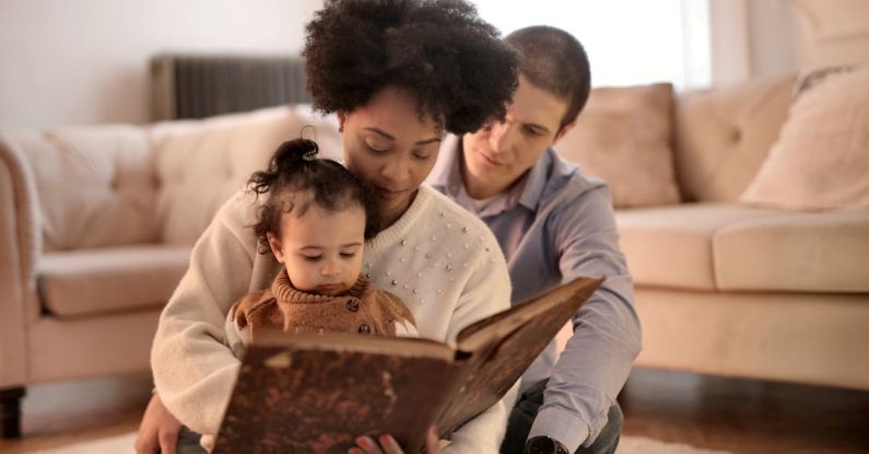 Storytelling - Photo of Woman Holding Brown Book With Her Child