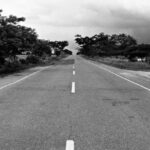 Uncertainty - Grayscale Photography of Concrete Road during Daytime