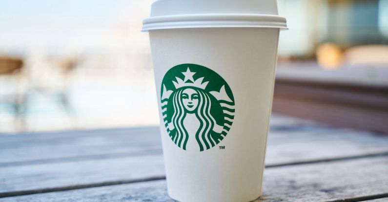 Branding - Closed White and Green Starbucks Disposable Cup